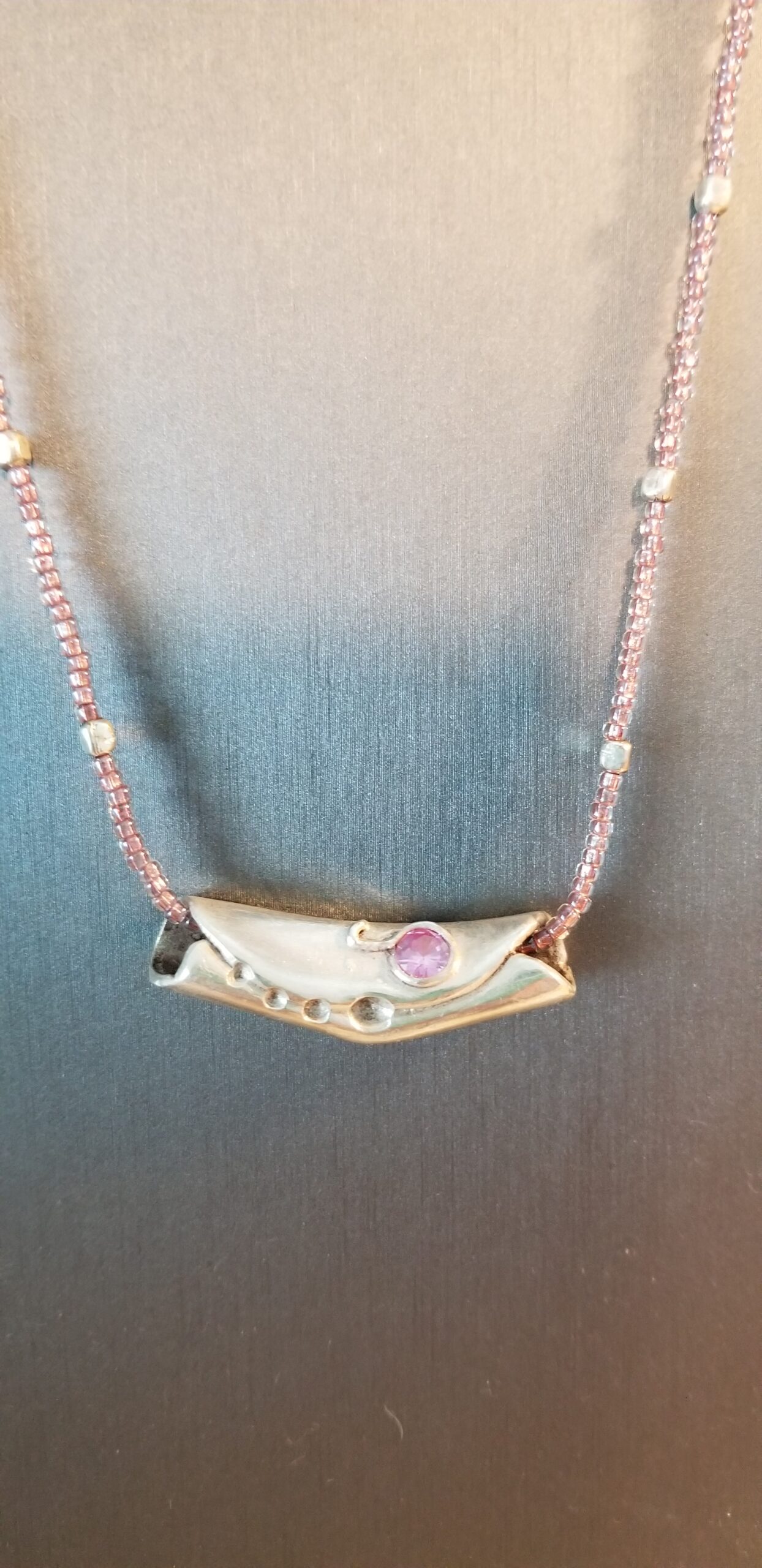 Art Clay tube with pink cubic zirconium on necklace of seed beads