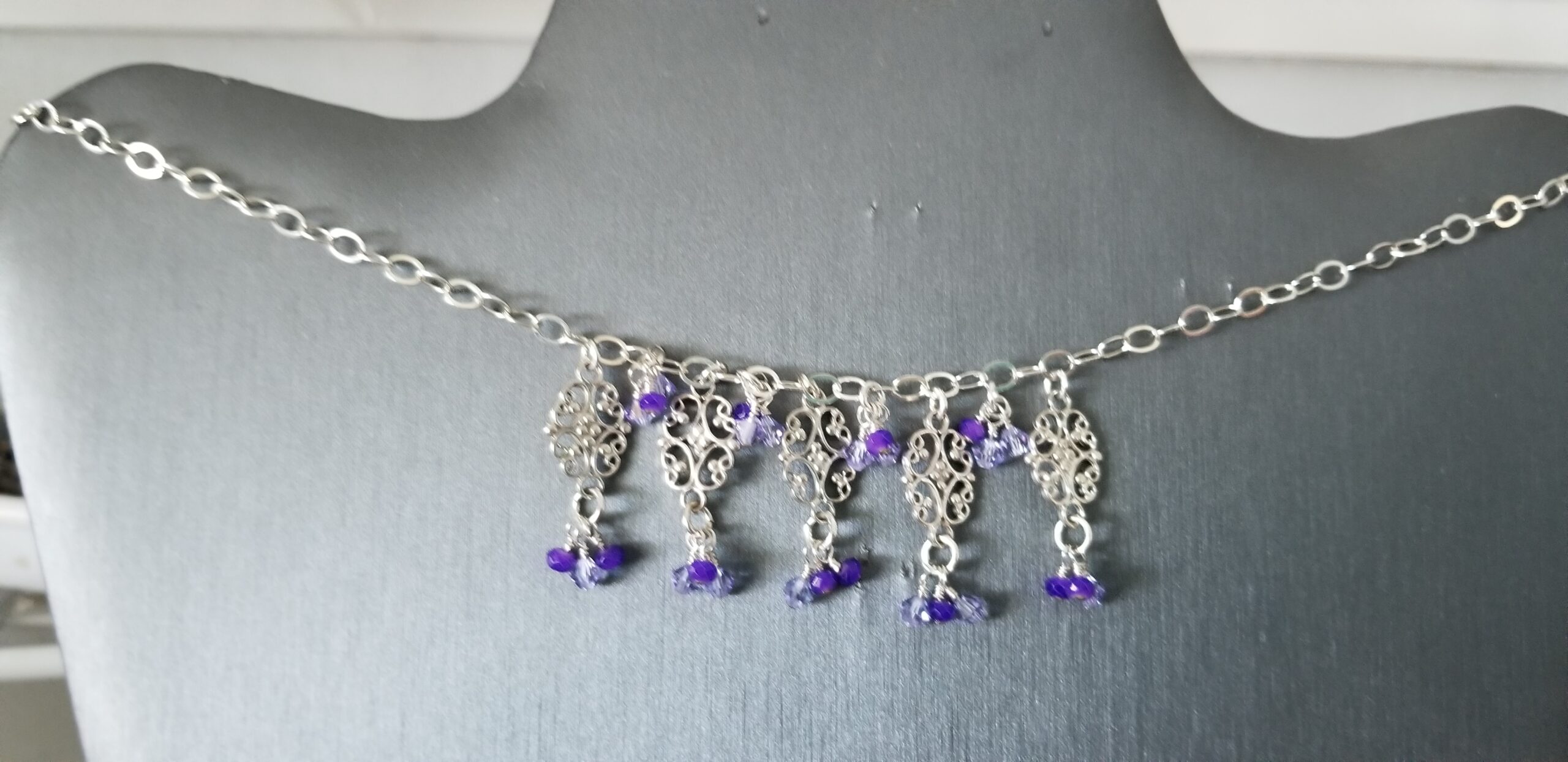 Set of Necklace, caterpillar bracelet and earrings with purple and clear droplets