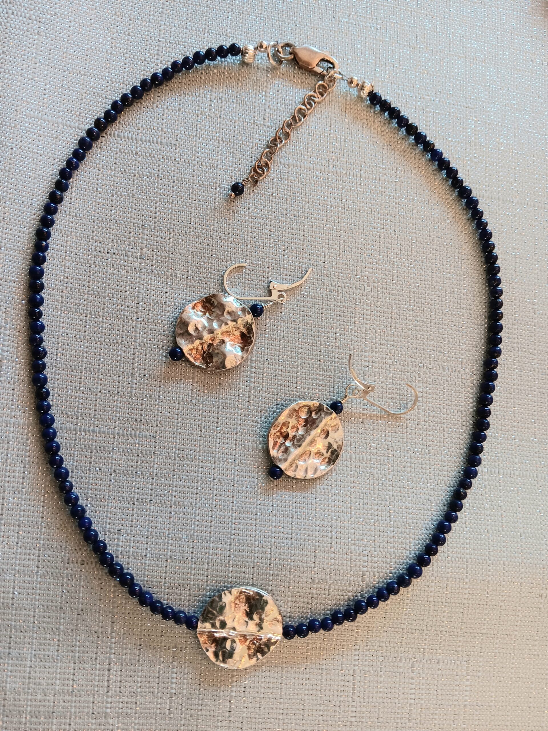 Lapis choker w/ sterling medallion. Matching earrings.