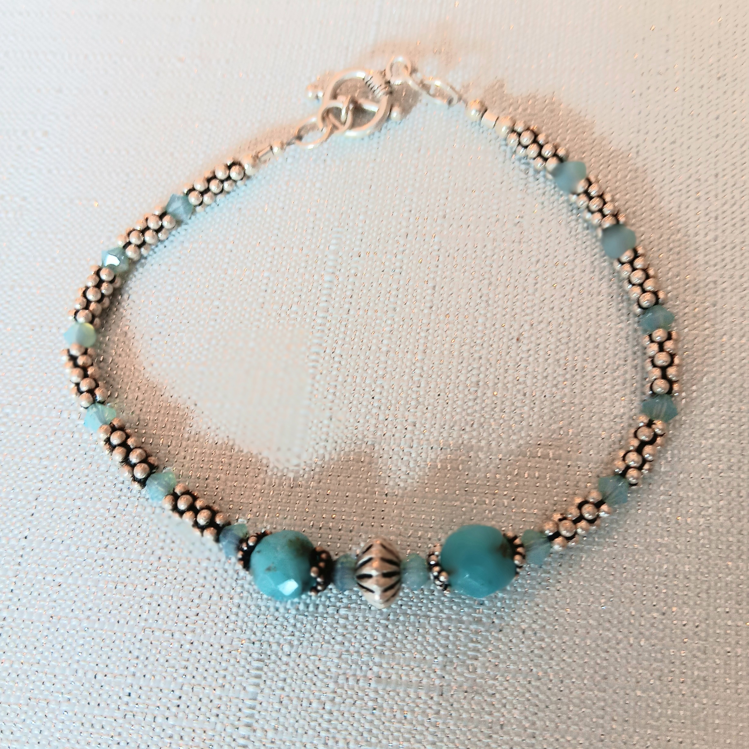 Bracelet of sterling discs and apatite beads