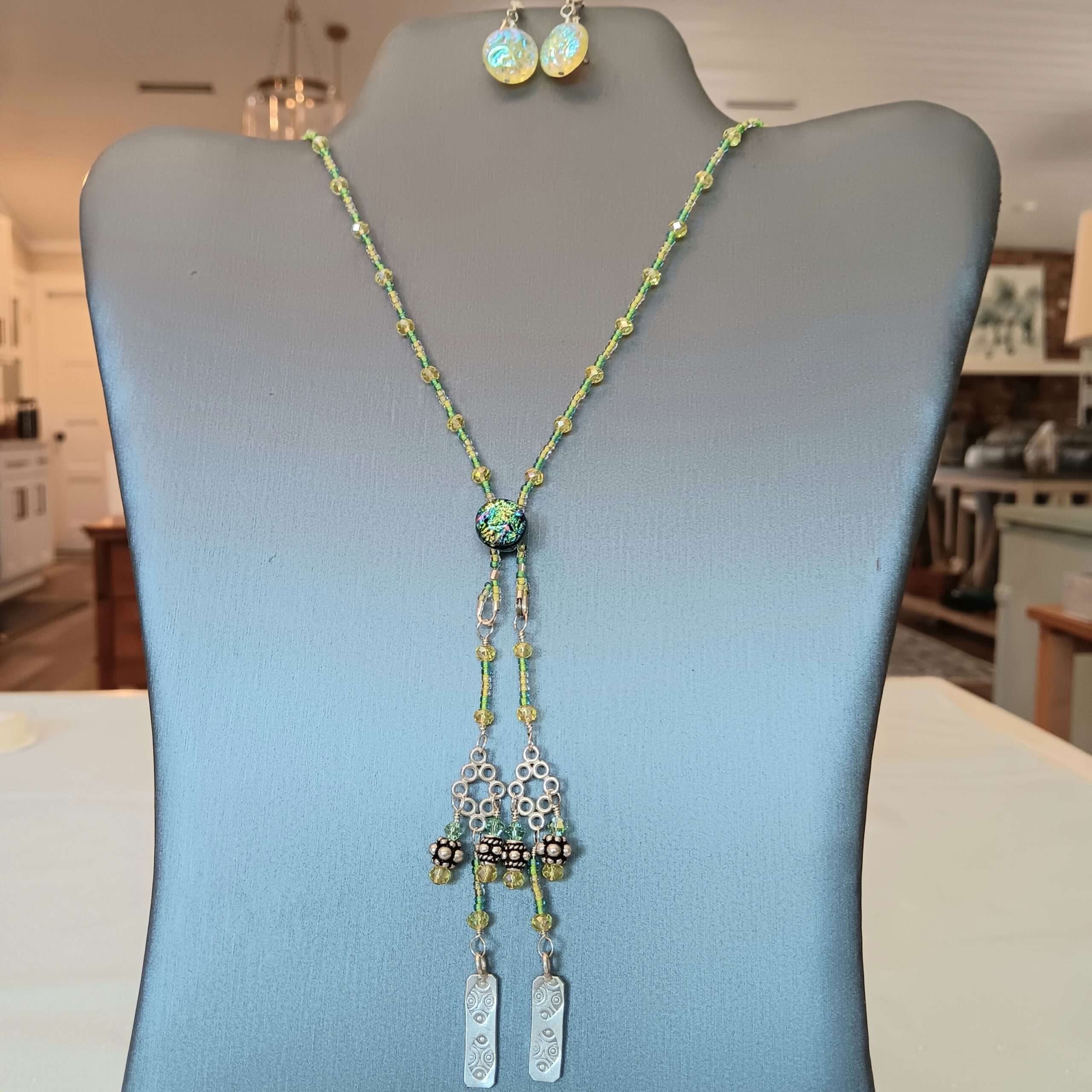 Green/yellow long necklace with multiple accents