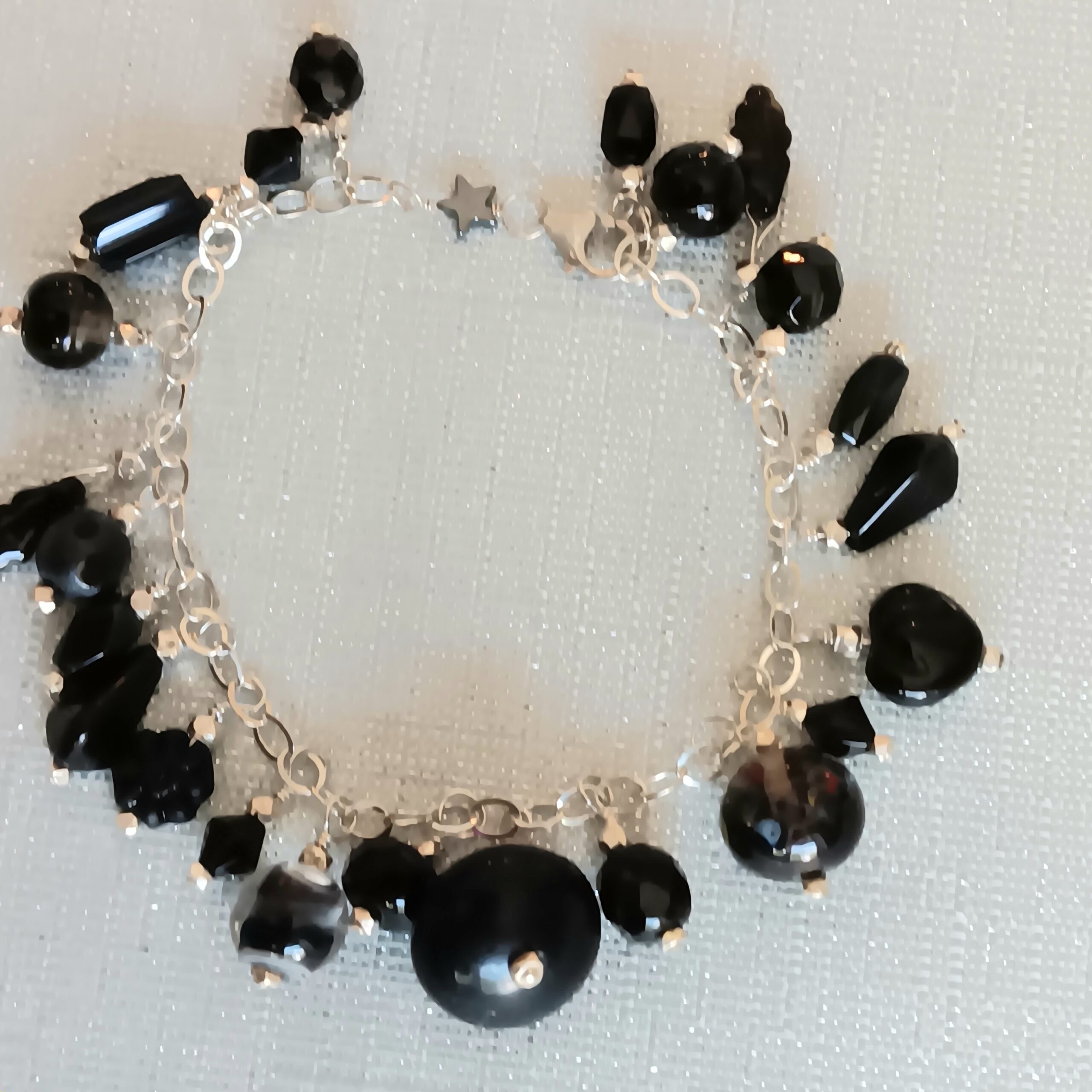 Black 'baubles' bracelet on sterling chain