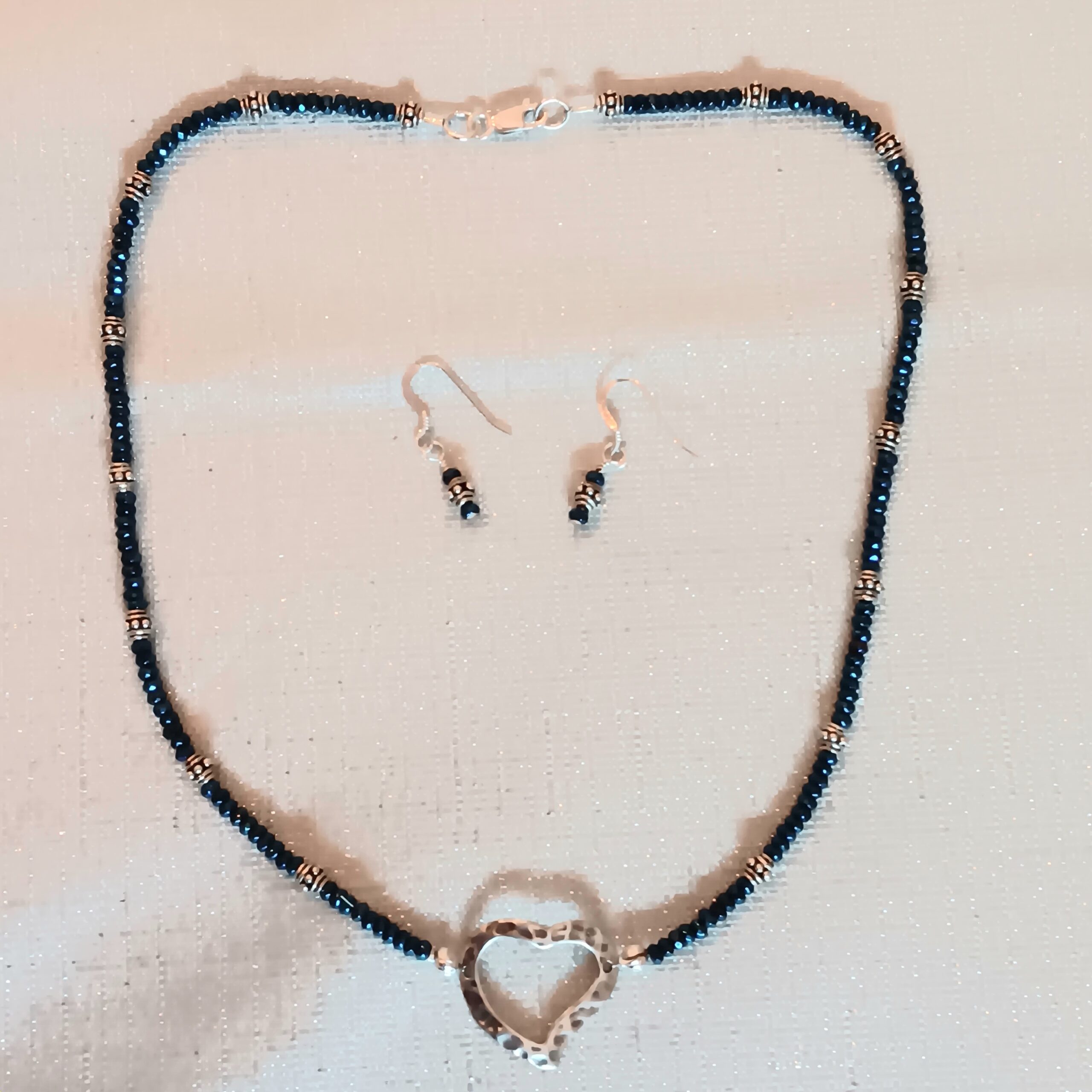 Deep blue crystals with open sterling heart.
