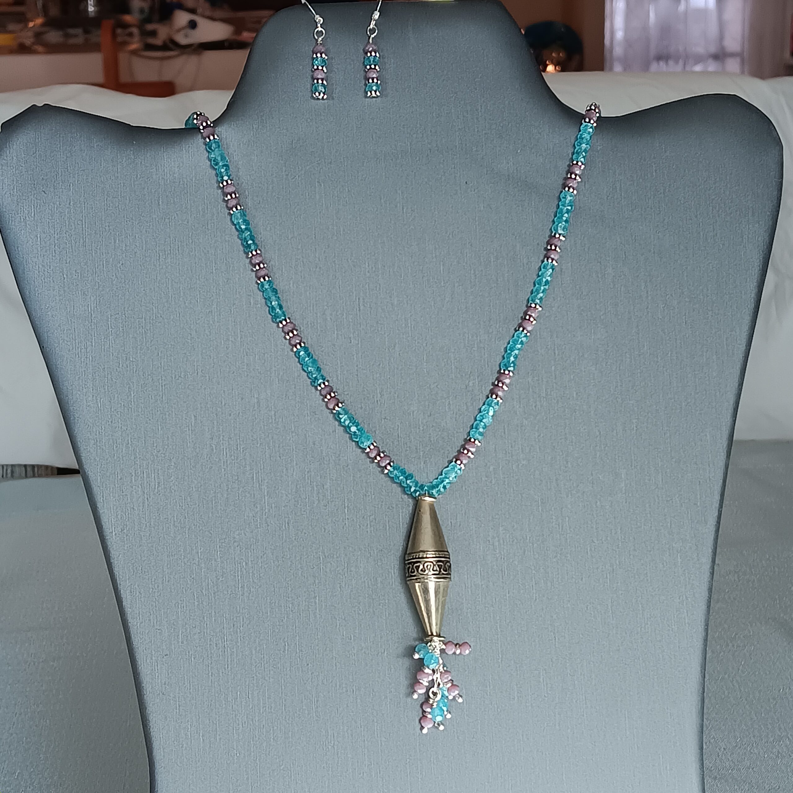 Teal and purple crystal necklace with large sterling bead. Earrings