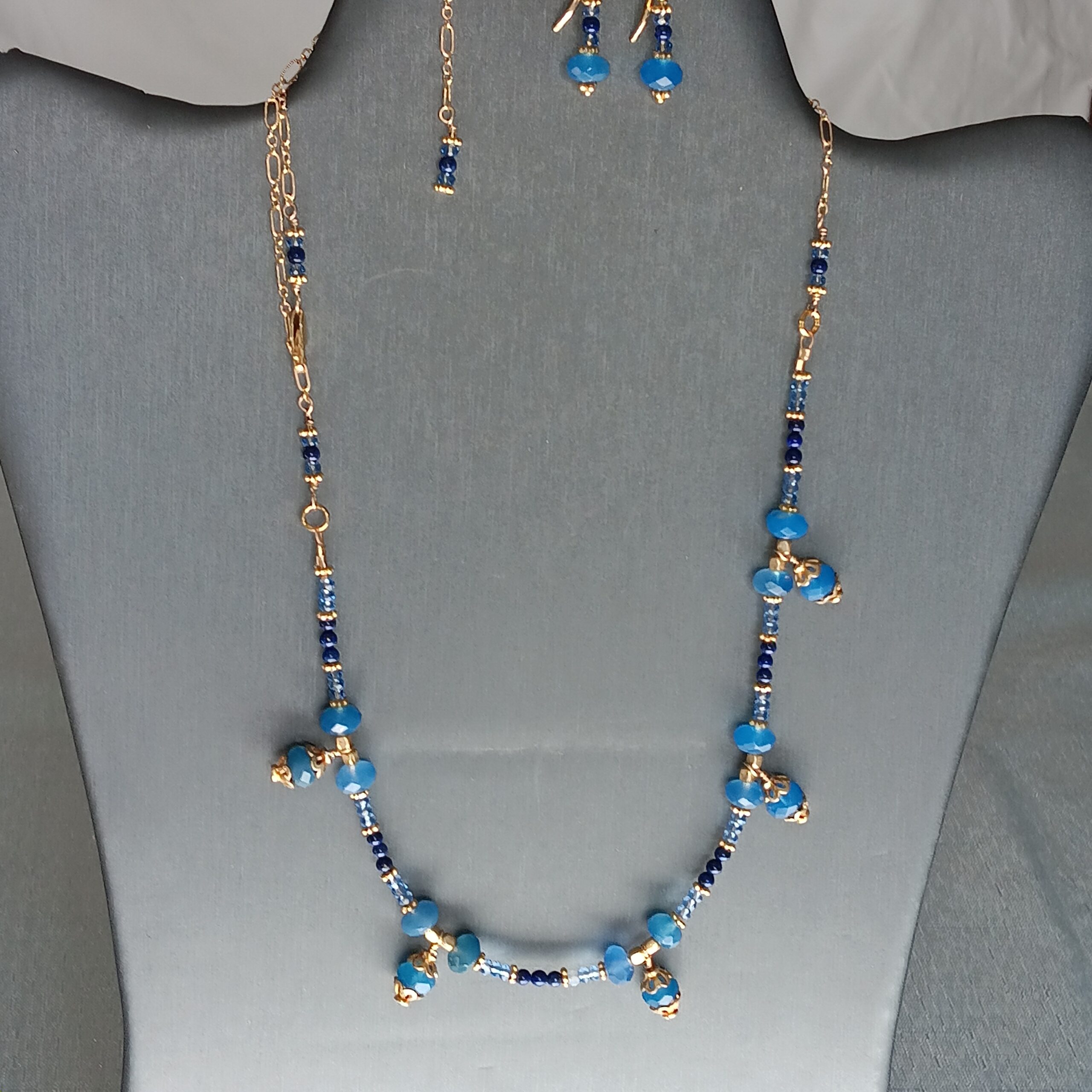 Chalcedony (blue rondelles), lapis, crystals and gold plated component necklace